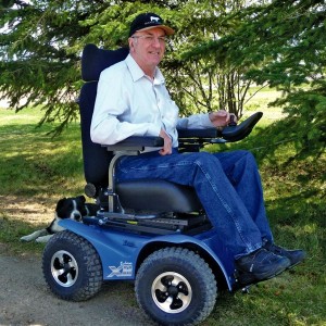 Man in electric wheelchair.