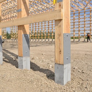 wooden fence on concrete pillars