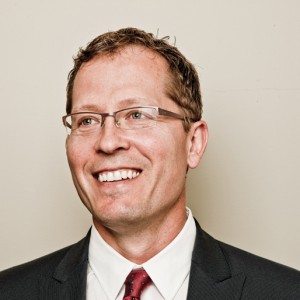 man with glasses wearing a suit