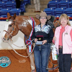 women standing beside a horse