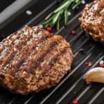 hamburgers on a barbeque grill