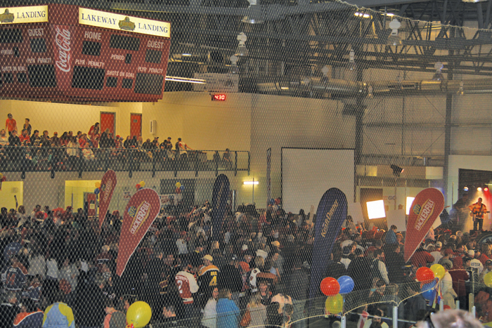 people gathered in a hockey rink