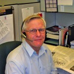 Man sitting at an office desk.