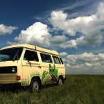 Volkswagen van in a prairie field.