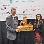 Jess Verstappen receives the 4-H Premier’s Award from Rod Carylon of the Rural Development division of Alberta Agriculture and Rural Development.