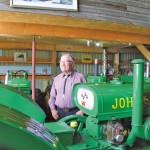 Gordon Gilchrist shows off the oldest tractor in his antique John Deere collection — a 1924 Model D.