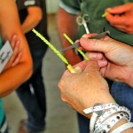 Germplasm technician Laura Hoge shows how it’s done during a hands-on plant-breeding demonstration at the recent Lacombe Field Day.