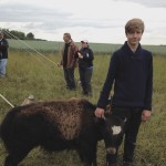 Drew Juuti, 15, stands with his bottle baby, EVangeline, a four-month-old yak. Evangeline is mostly yak, but has a little bit of cow in her as well.