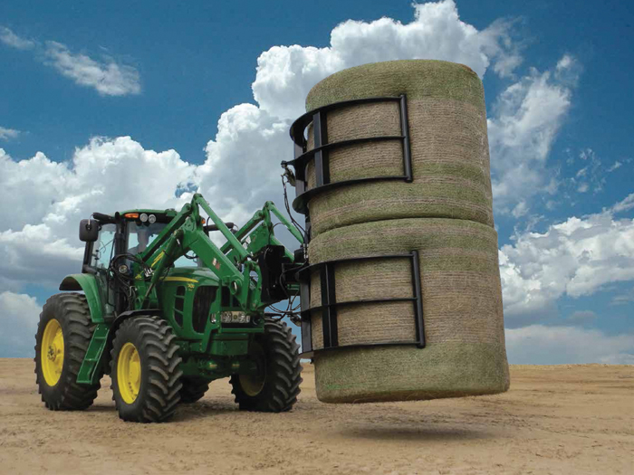 tractor managing a bale