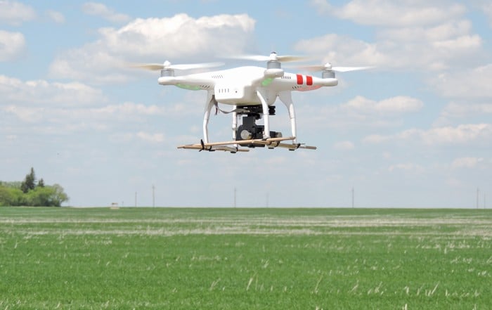 an aerial drone flying over a crop