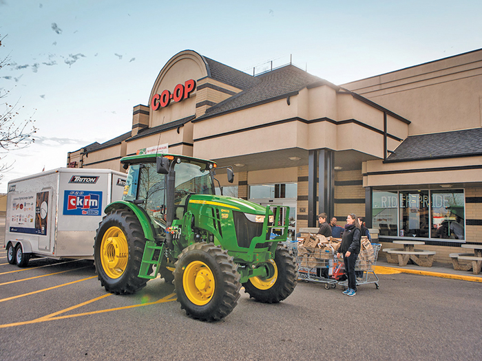 tractor hauling food to a food drive