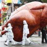 large inflatable chicken at a protest march