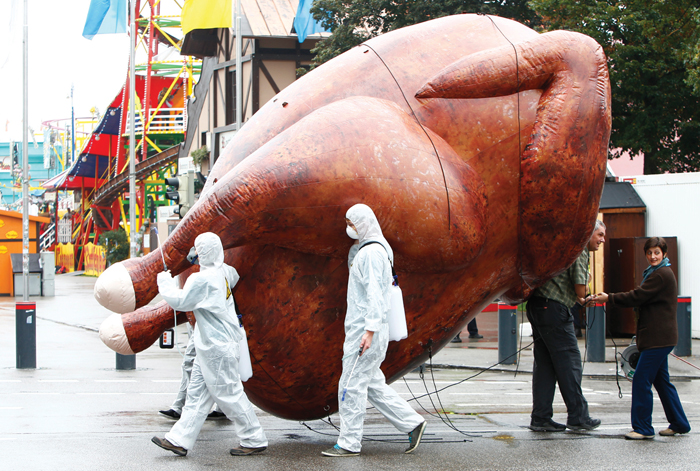 large inflatable chicken at a protest march