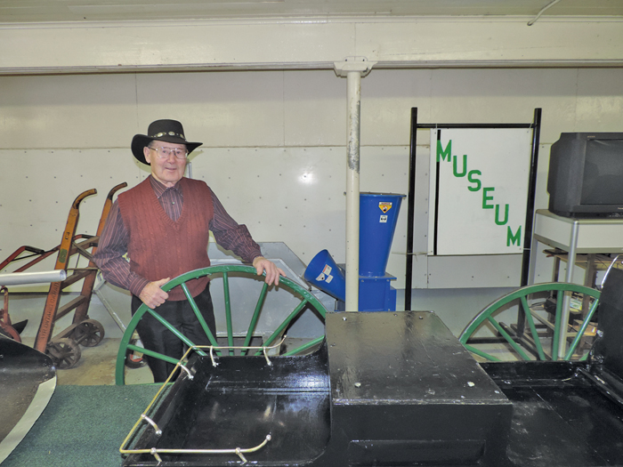 man in antique agricultural museum