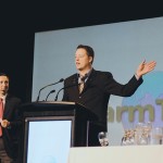 man on stage at conference