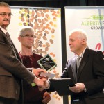 Alberta’s first bean grower Lud Prudek (right) was awarded the inaugural Alberta Pulse Industry Innovator Award by outgoing pulse growers’ president Richard Krikke (left) and Zone 1 chair Will Van Roessel.