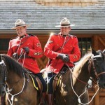 Cpls. Dave Heaslip (left) and Christian Reister, the province’s southern livestock investigators, sit atop of their horses, Spud and Duke, as part of a promotion for Banff Tourism.