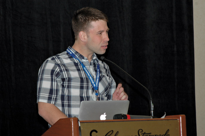 man presenting at podium