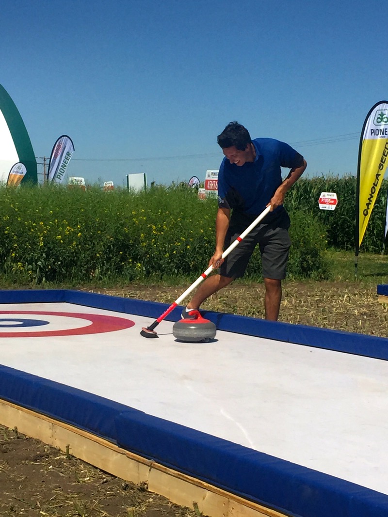 DuPont Pioneer’s booth includes an outdoor “rink” and the chance to throw a rock with two-time Brier champion Pat Simmons.