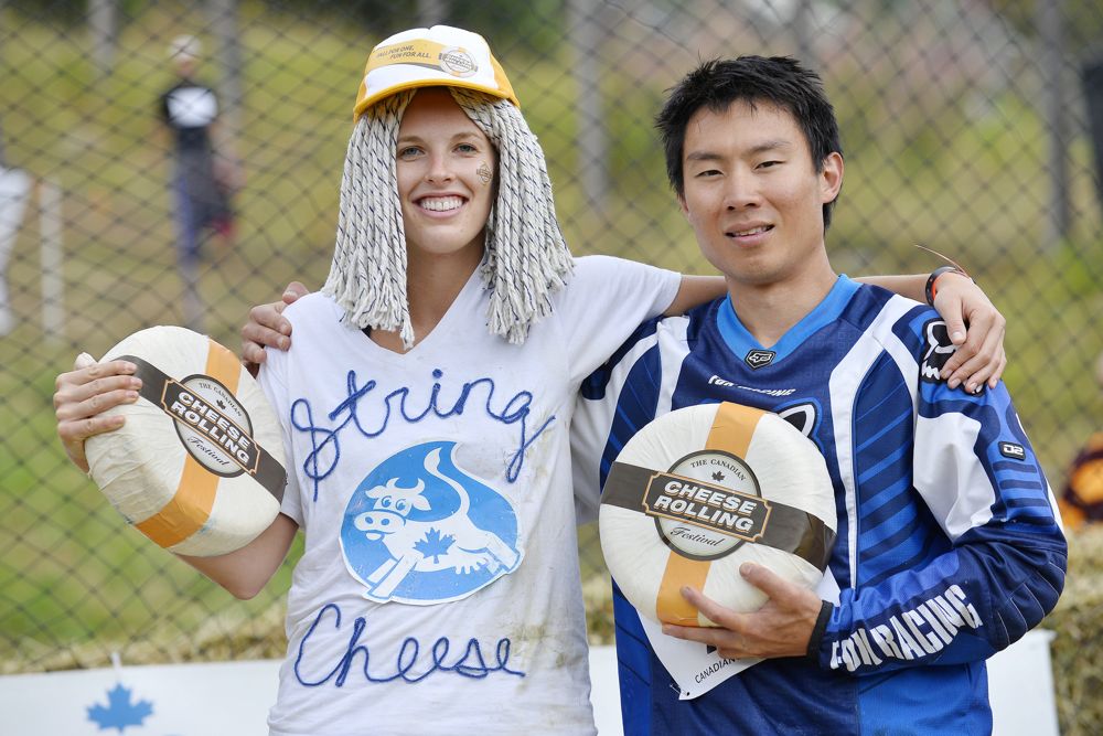 As champions at the 2015 Canadian Cheese Rolling Festival on Aug. 15, Rebecca Sharar of Bainbridge, Wash. and Paul Nguyen of Whistler, B.C. each received an 11-lb. wheel of Canadian Boerenkaas cheese.