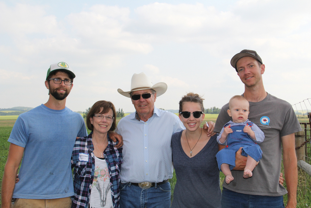 Mike Kozlowski (left) and Blake and Angela Hall with son Hawksley (right) have partnered with Tom and Margaret Towers in a unique approach to succession planning. 