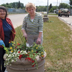 Dozens of volunteers, such as Audrey Petruk (left) and Claudette Stetsko in Redwater, help make Communities in Bloom a success.