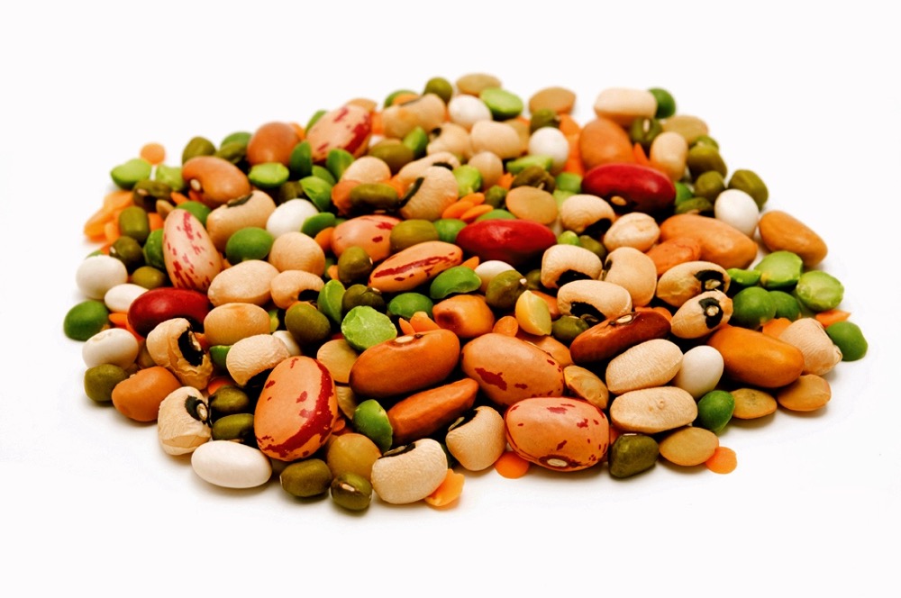 Dried legumes and cereals on a white background