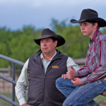 Darren Simpson and son Wyatt of Consort take a rare rest in one of the stills
from “Cowboy Up!”
