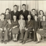C.C. (left) and Anna Toews, with their children and ‘Uncle Corny.’ In front (left to right) Gerry, Eleanor, Allen, and Erma. In the rear, Gladys, Henry, Fred, Wes, and Ruth.