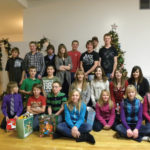 In this 2009 photo of the Retlaw Prairie 4-H Beef Club, Jake Drew is second from the left in the front row (wearing a red T-shirt). Calvin Holthe is second from the left in the back row (in a black and white plaid shirt)
and is standing next to his brother Curtis (third from the left).