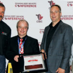 Tim McAllister was presented with his outstanding researcher award at the Canadian Beef Industry Conference earlier this month. From left to right, Beef Cattle Research Council science director Reynold Bergen, McAllister, council chair Bryan Thiessen, and Darren Bevans, a council director and general manager of Deseret Ranches.