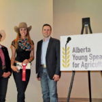 Emily Ritchie’s prizes included a $1,000 cheque, presented by Eric Dalke and
Deb Hart of the Alberta Young Speakers for Agriculture competition.