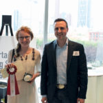 Aleri Swalwell received a buckle, ribbon, and $500 prize from Eric Dalke,
founder of the Alberta Young Speakers for Agriculture competition.