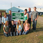 Being in a specialty market is helping to protect the hog operation run by Marcel Rupert
(second from right) and his partner Tony Lansink (third from left).
