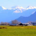 Rural Landscape in south western Canada and snow capped mountains