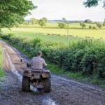The new regulation will require most people, but not farmers, to wear a helmet when riding on Crown land, public roadways, and highway rights-of-way.