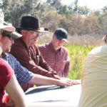 Taking a bit of time to create a grazing plan will pay good dividends for years, says rangeland specialist Pete Deal
(centre in cowboy hat).