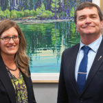Jennifer Wood, new chair of the Agricultural Financial Services Corporation board, is introduced at a press conference by Agriculture Minister Oneil Carlier.