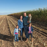 Jared Wever, pictured with wife Megan and their three children, sees a bright future
for corn in Alberta.