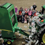 As the power take-off shaft catches hold of the dummy's clothing, the motion rips the dummy apart, sending newspaper flying into the air.
