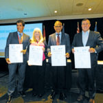 Parmalat Canada senior vice-president Gilles Froment, (l to r) Dairy UK chief executive Judith Bryans, outgoing Dairy Farmers of Canada president Wally Smith, and Dairy Processors of Canada president and CEO Jacques Lefebvre show off copies of the Rotterdam Declaration.