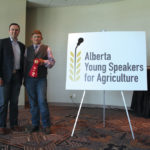 Quinten Albrecht, who won the $500 first-place prize in the junior division of this year’s Alberta Young Speakers for Agriculture competition, and competition founder Eric Dalke.
