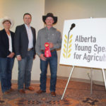 Chancey Lane, pictured with incoming Alberta Young Speakers for Agriculture president Deb Hart and competition founder Eric Dalke, won $1,000.