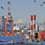 A mountain to climb? Reaching a deal with Japan and the other nine countries in the Trans-Pacific Partnership talks could boost canola and beef exports alone by more than $1 billion, but there would be big losses if talks founder. Pictured is Tokyo’s port with Mt. Fuji in the background.