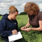 Enrolment in Lakeland College’s agriculture sciences program has almost tripled since Josie Van Lent (r) (seen here with former student Sheena McKelvie) became dean in 2007.