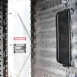 The GrainViz imaging sensors (the black device) magnetically attach to the inside bin wall. A 24-sensor array provides 3D imaging, revealing the moisture content of every bushel in the bin.