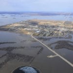Seven years ago, flooding caused more than $1 billion in damages in Manitoba. Shown is a 2011 photo of the southern Manitoba town of Morris, which is protected by a ring dike.