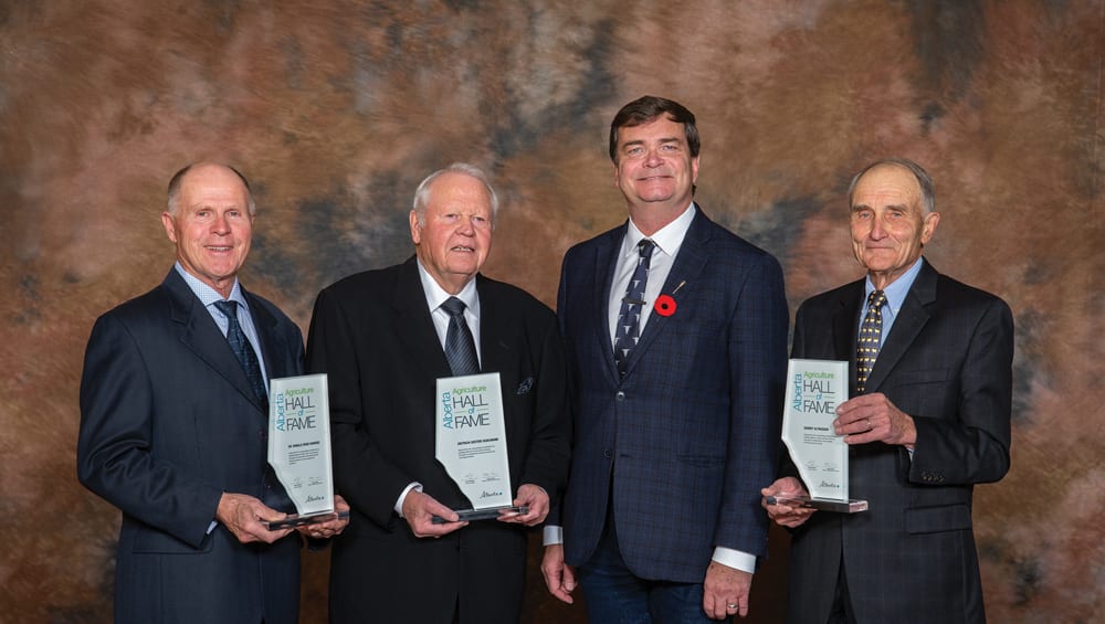 The 2018 Agriculture Hall of Fame inductees (from left, with Agriculture Minister Oneil Carlier) are Ronald Howard, Dietrich Kuhlmann, and Garnet Altwasser.