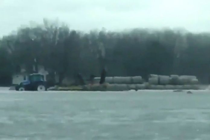 A view of a farm partially submerged in floodwater at Scribner, Neb. on March 14, 2019, in a still image from video obtained from social media on March 19. (Video screengrab from Angie Lange via Reuters)
