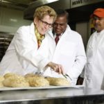 Ontario Premier/Agriculture Minister Kathleen Wynne, shown here at Scarborough’s Stonemill Bakehouse in April, returns to Queen’s Park with a majority mandate after Thursday’s election. (Premier.gov.on.ca via Flickr)